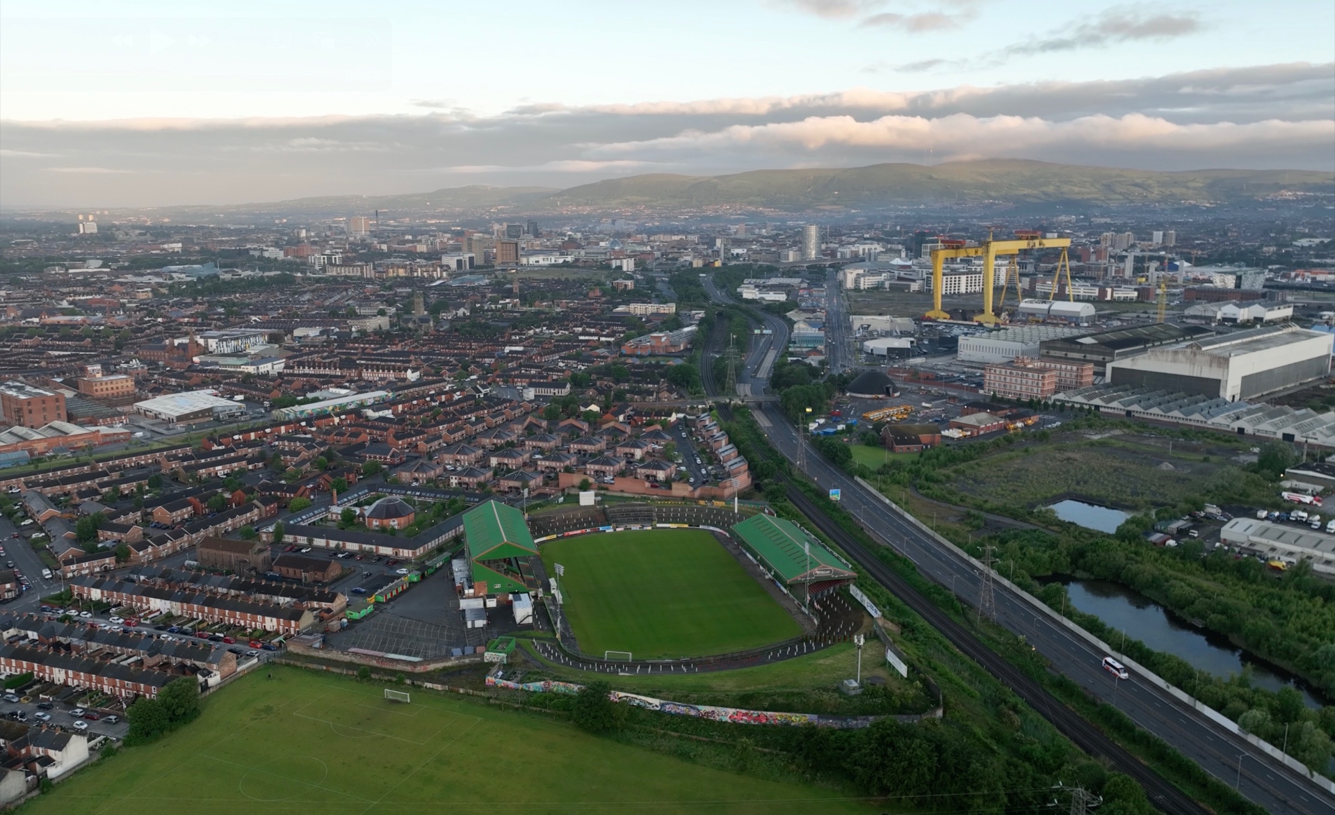 Aerial view of Glentoran FC's ground in east Belfast with the Harland & Wolff cranes beyond