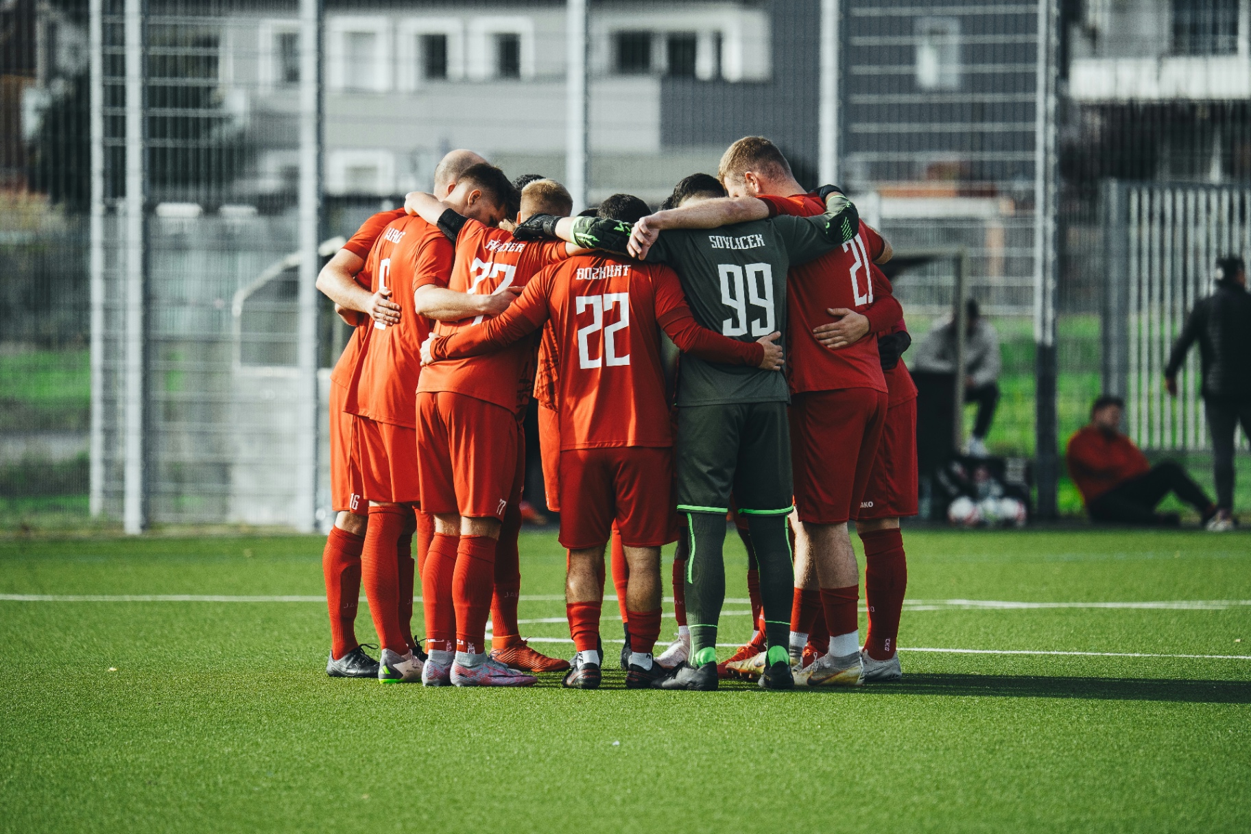 Bravia Sports squad in a huddle on the pitch before a match